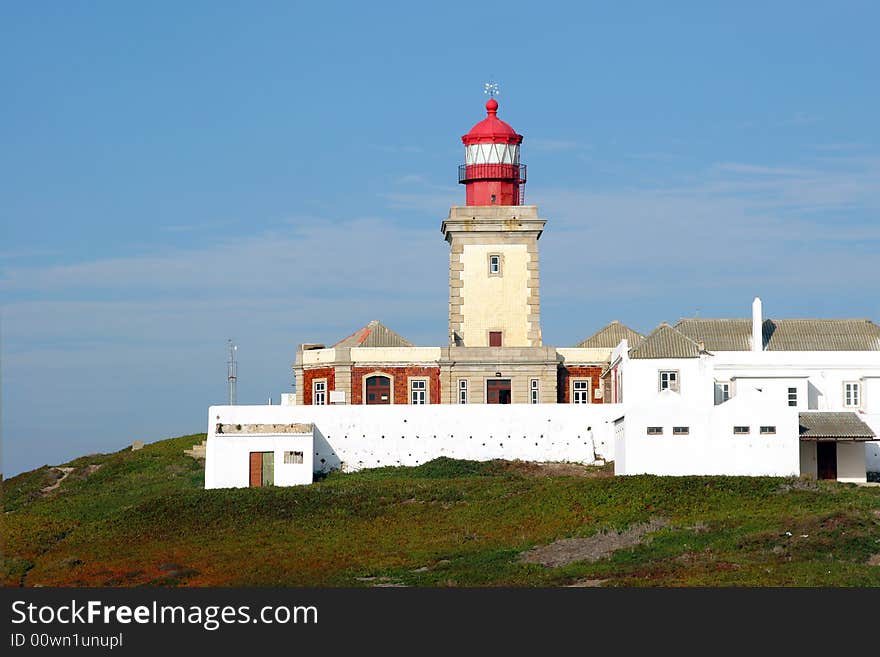 Old historic red lighthouse building. Old historic red lighthouse building