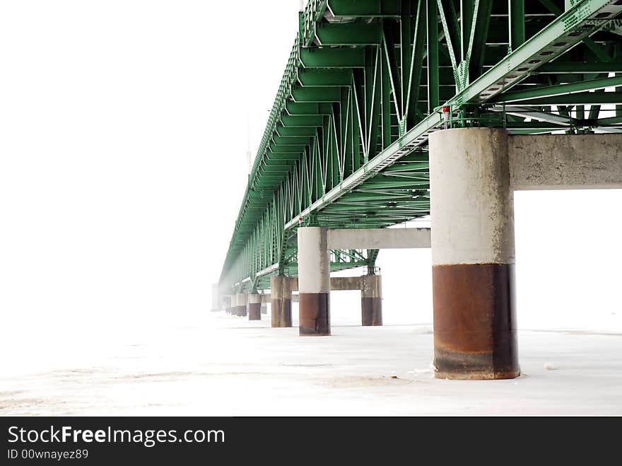 View of Bridge from underneath. span disappearing into heavy weather. View of Bridge from underneath. span disappearing into heavy weather.