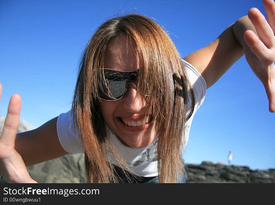 A white caucasian girl getting up close and personal with the photographer.