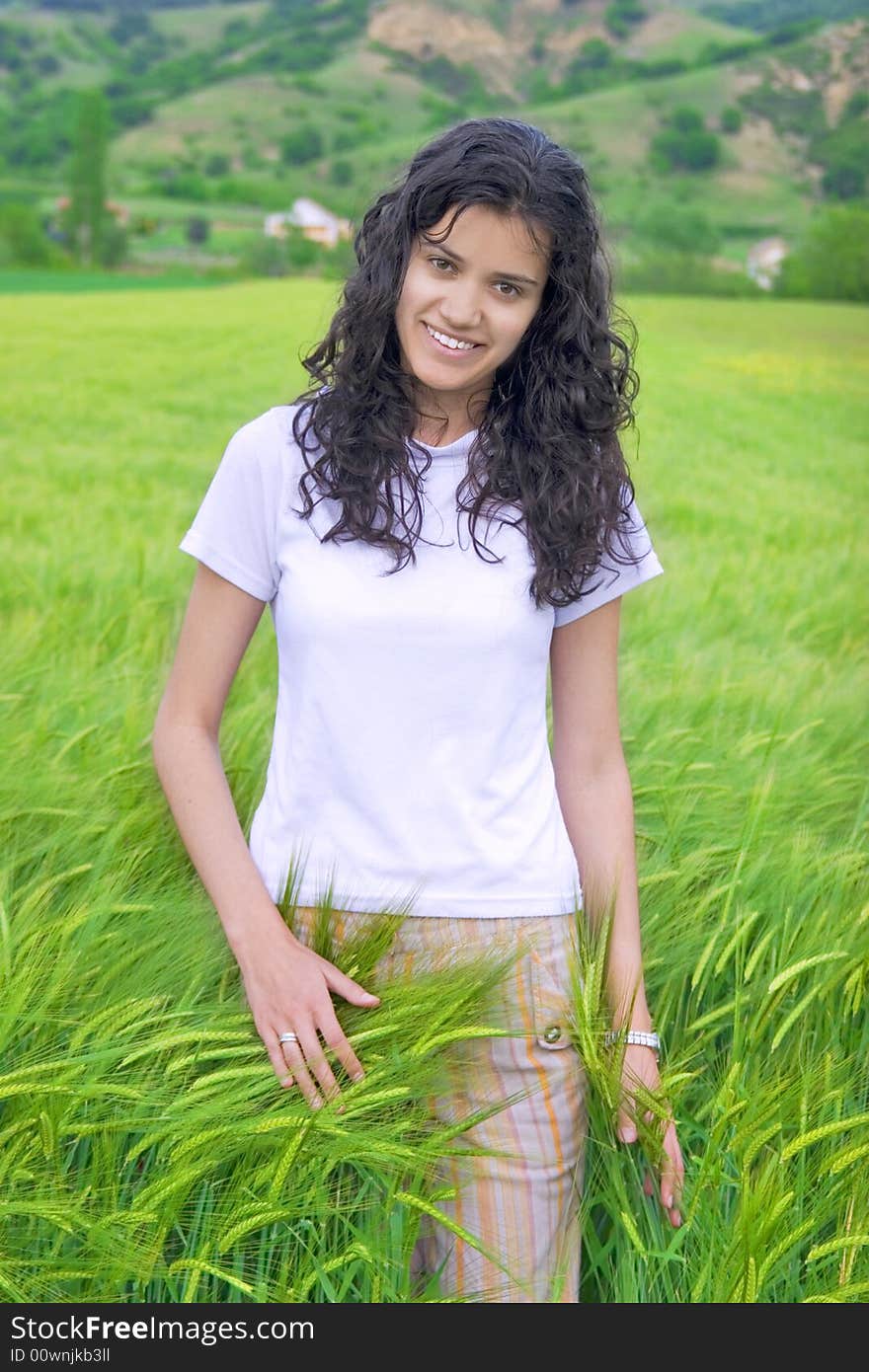 Young woman in field of wheat