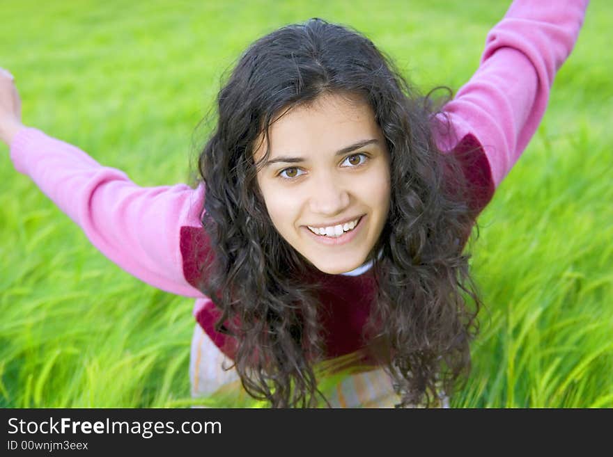 Happy young woman in green field of wheat. Happy young woman in green field of wheat