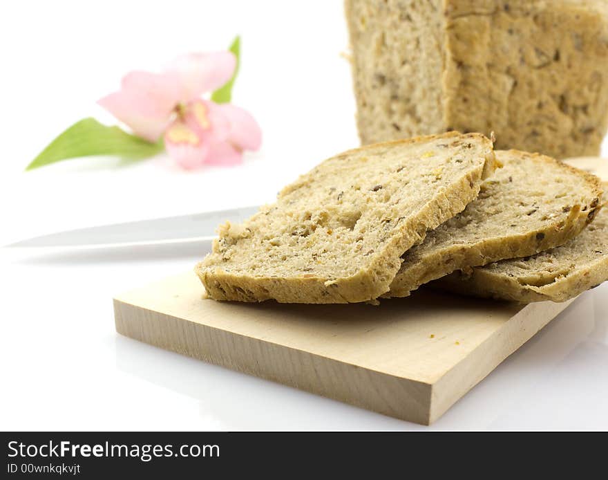 Cut Rye Bread Loaf And A Flower, Isolated