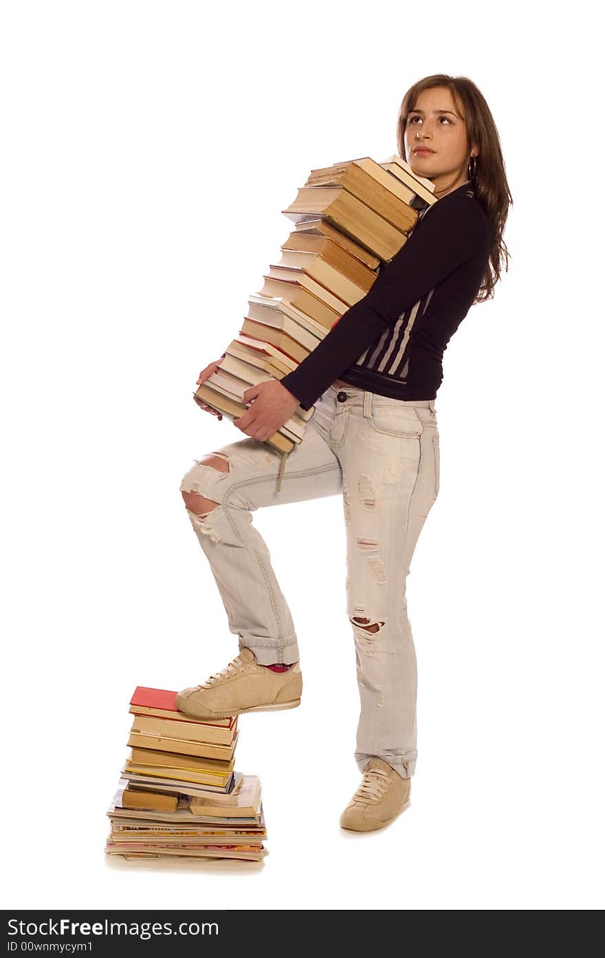 Young student girl with her books on white