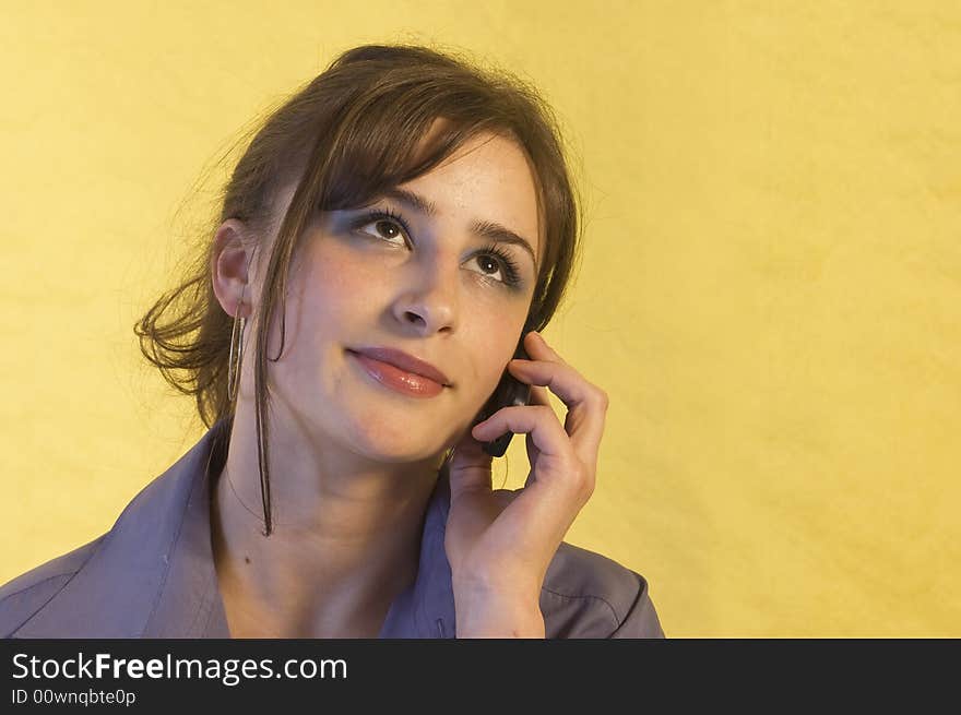 Young business woman making a mobile call