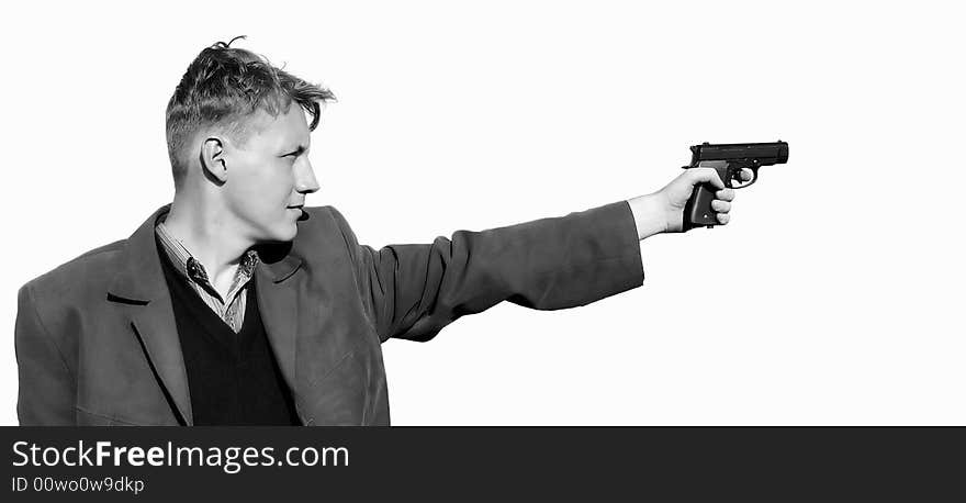 A young man standing with a gun