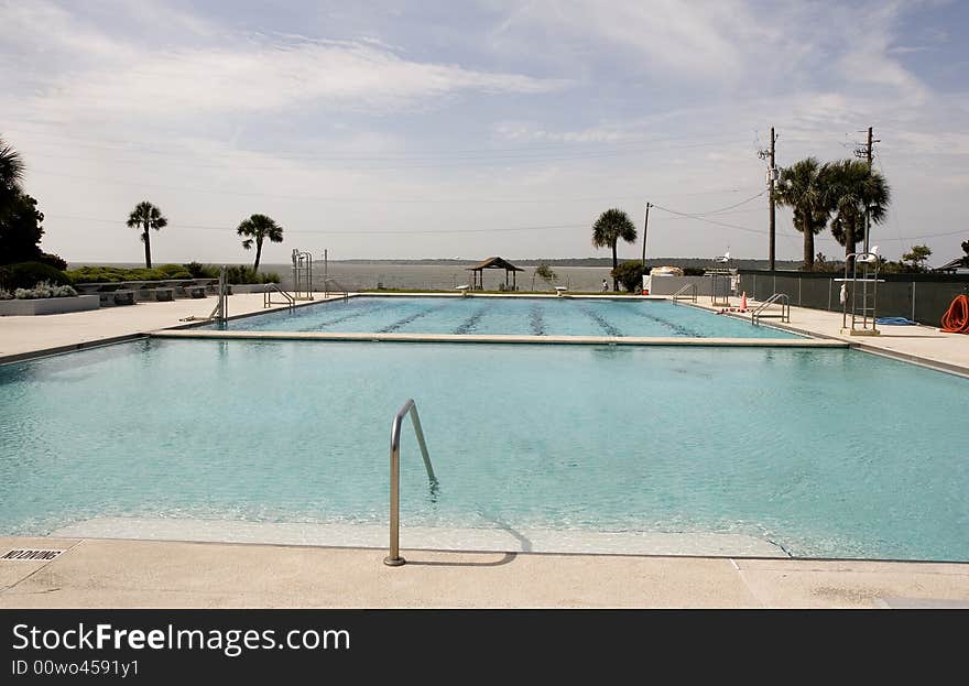 An empty swimming pool on the beach in early spring. An empty swimming pool on the beach in early spring