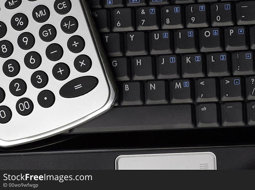 Business Tools - Silver Calculator On A Black Laptop Keyboard. Business Tools - Silver Calculator On A Black Laptop Keyboard