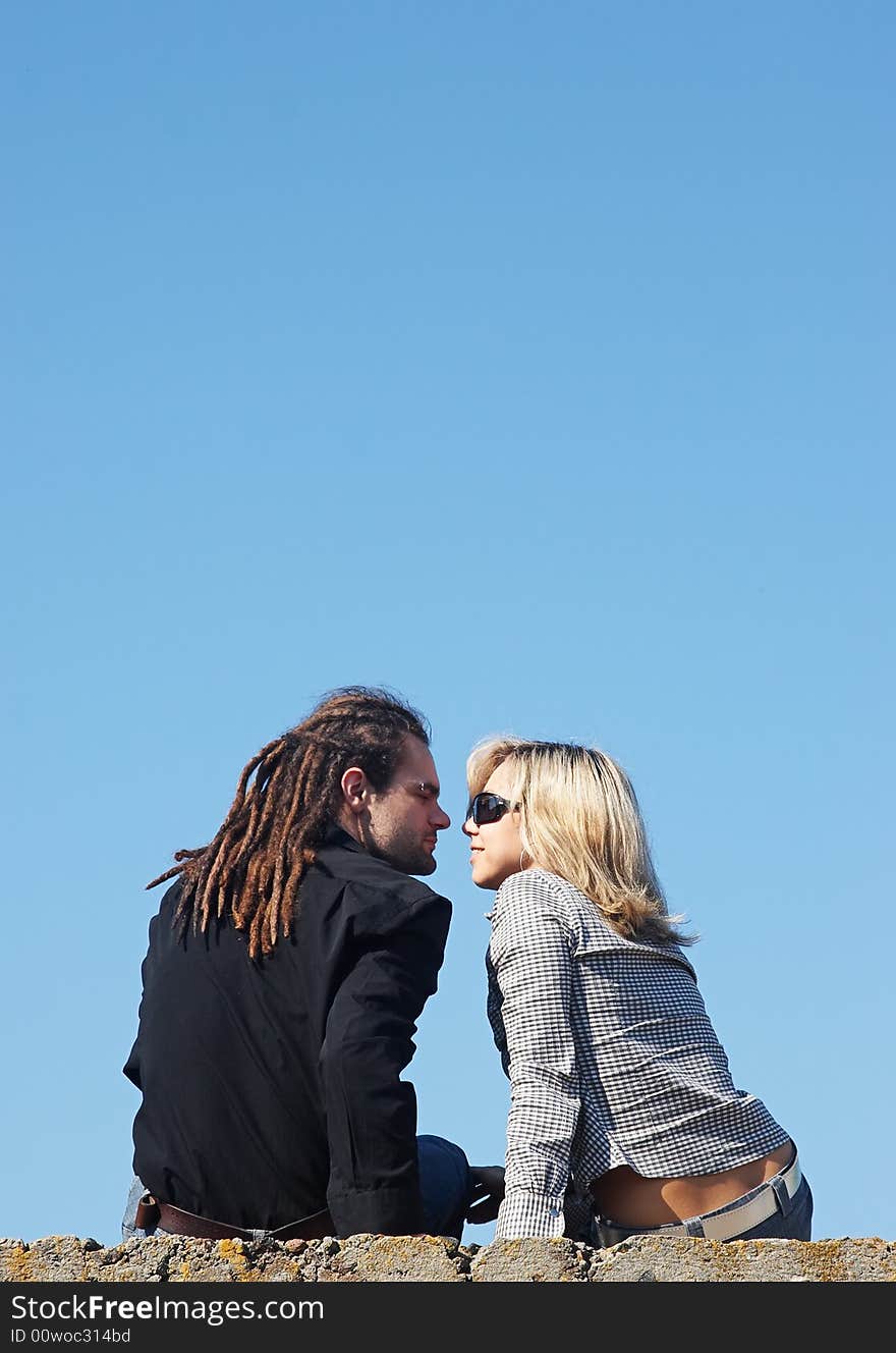 Couple kissing under the sky