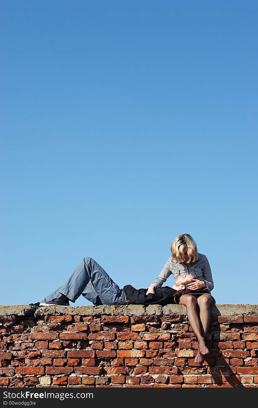 Man lying with his head on woman's knees. Man lying with his head on woman's knees