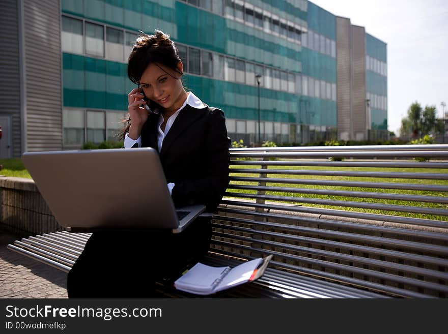 Young businesswoman working outdoors