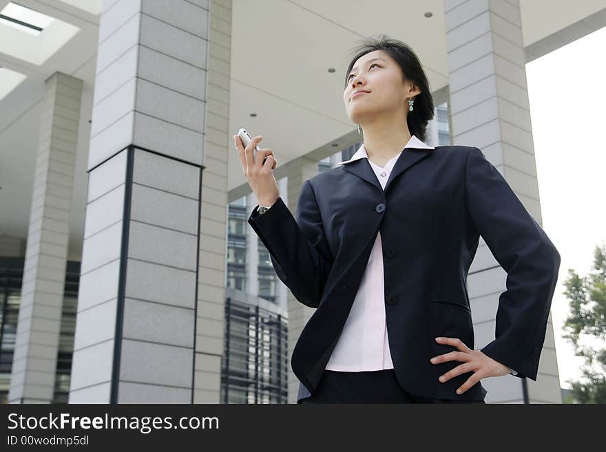 Business women holding a mobile phone