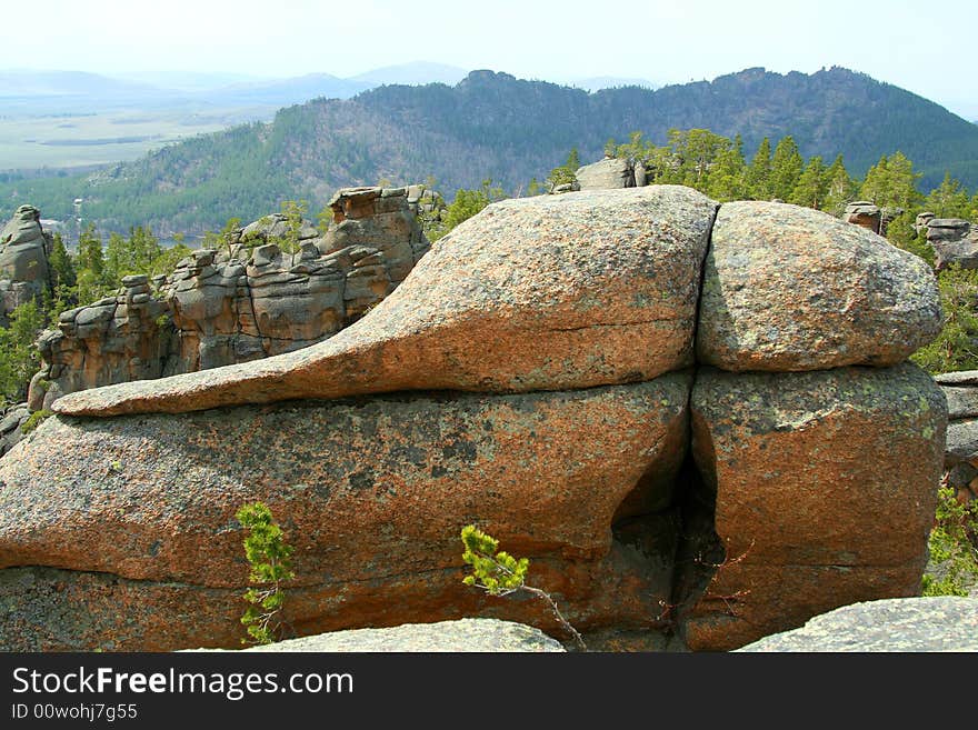 Close up of rock on background of beautiful landscape