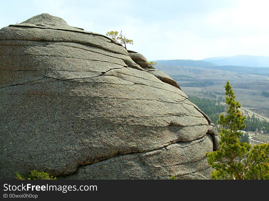 Close up of rock on background of beautiful landscape