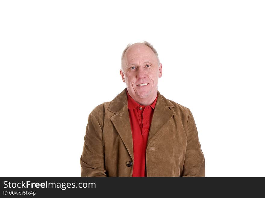 A man wearing a red shirt and suede jacket smiling. A man wearing a red shirt and suede jacket smiling