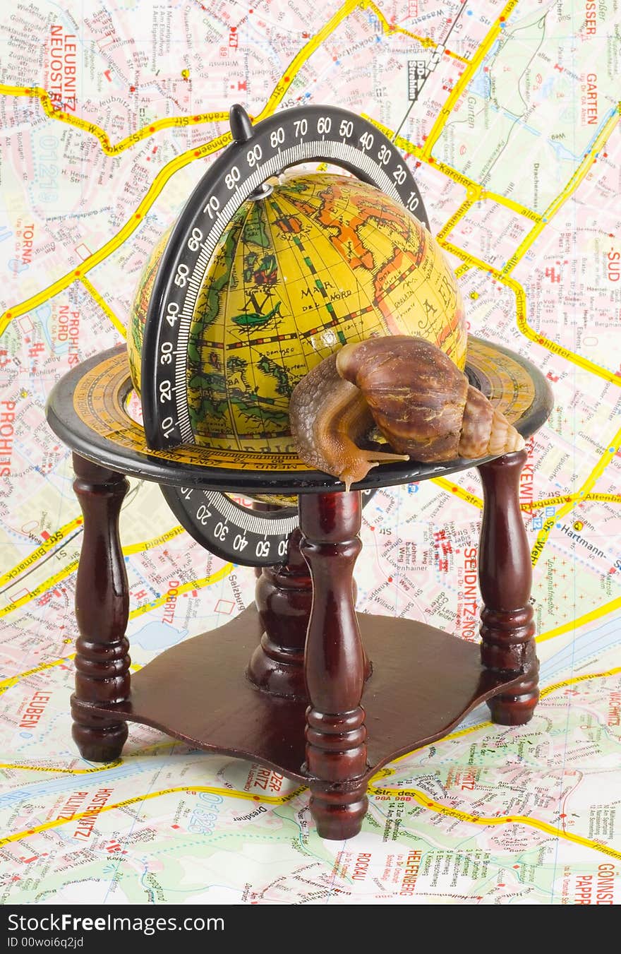 Around the world - slowly but safely - snail on the globe
