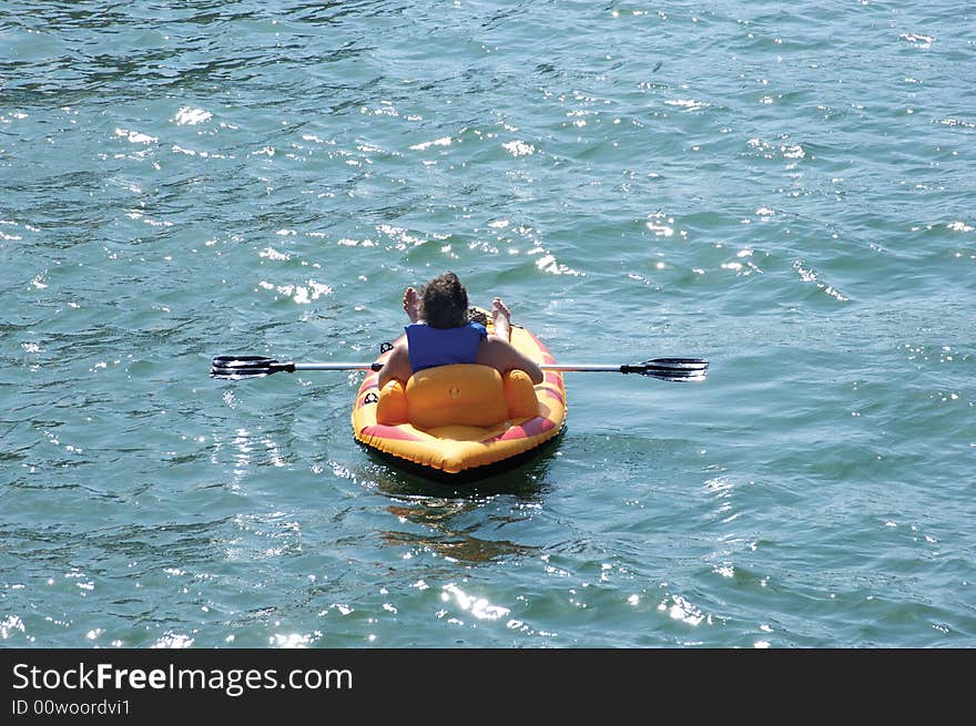 Man relaxing in an inflatable kayak