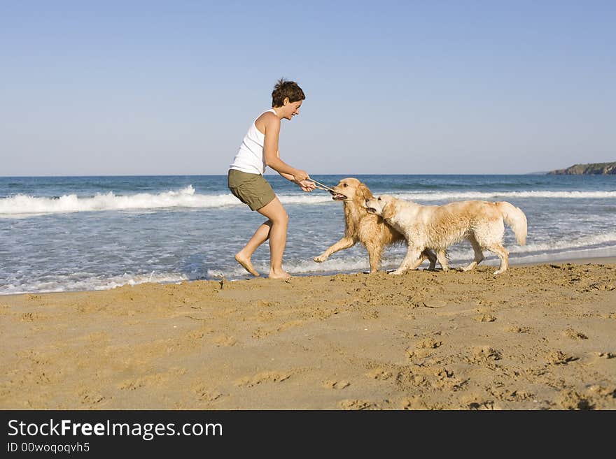 Yong girl playing with her dogs