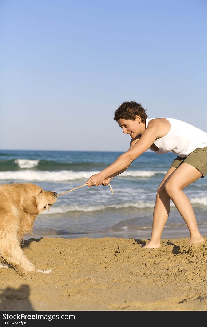 Yong girl playing with her dog