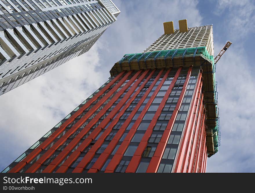 Red lined apartment building with scaffolding moving upwards. Red lined apartment building with scaffolding moving upwards