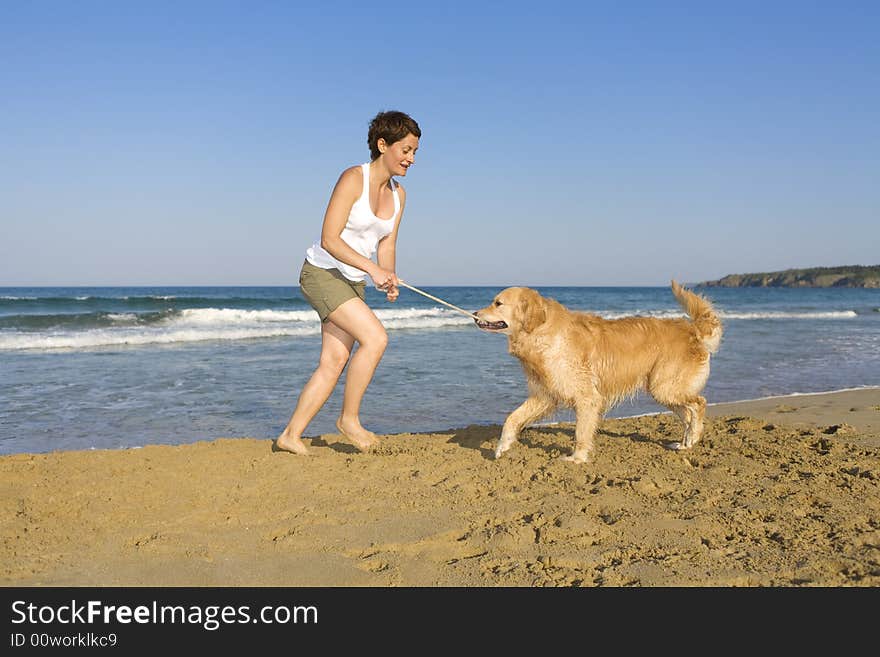 Yong girl playing with her dog