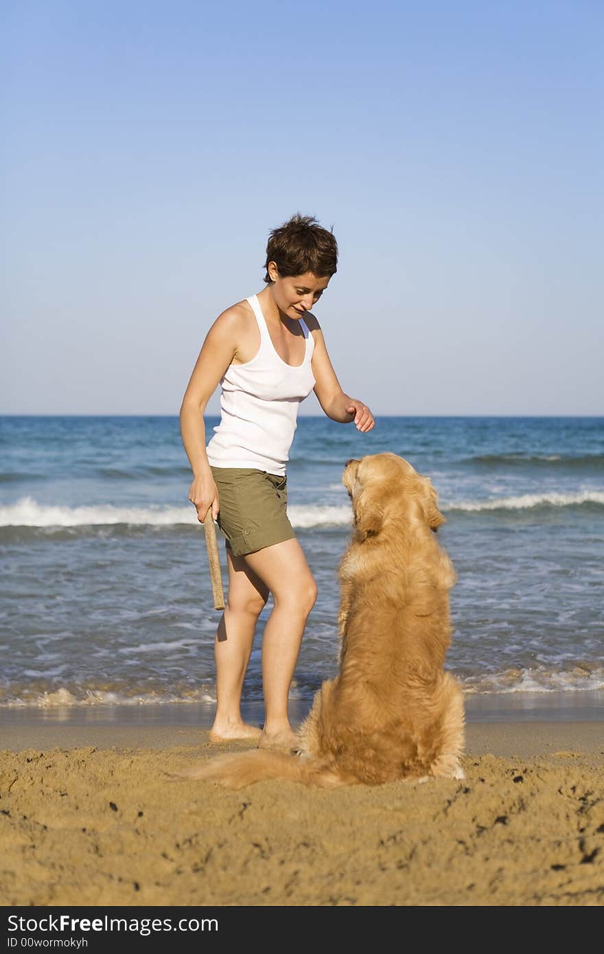 Yong girl playing with her dog