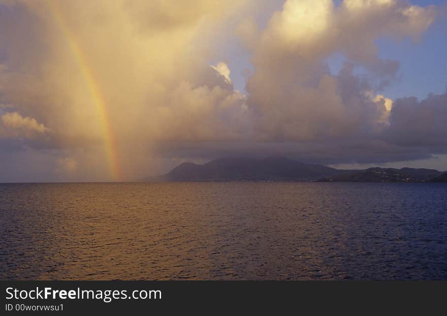 Early morning at St kitts with a rainbow over the island