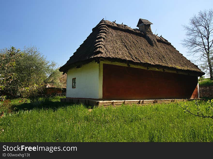 Old traditional ukrainian house with thatched roof