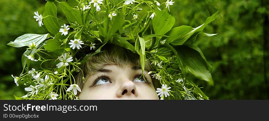 Close-ups portrait of caucasian girl in wreath.