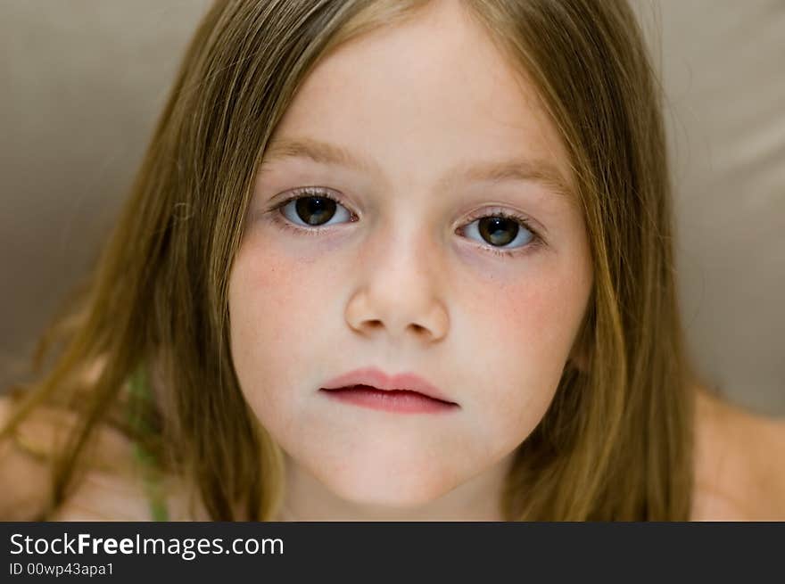 Portrait of pretty young girl with long straight hair.