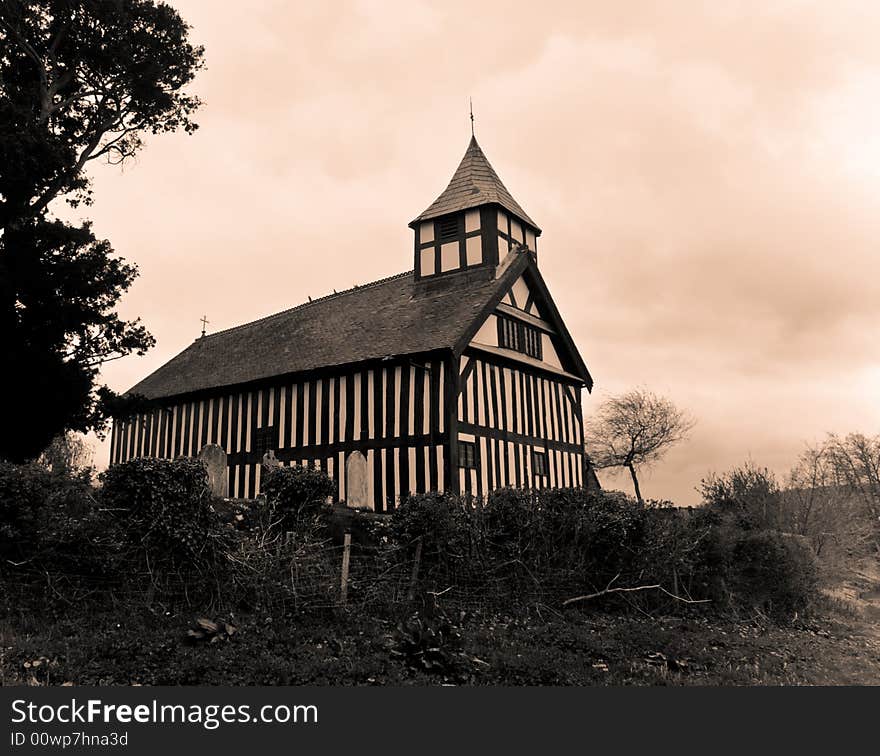 Melverley Church in Shropshire under a cloudy sky in an old fashioned print. Melverley Church in Shropshire under a cloudy sky in an old fashioned print