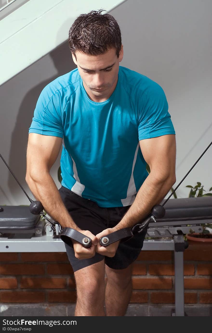 A shot of a weightlifter doing a butterfly curl.