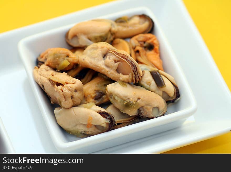 Some fresh mussels in decorate table ware