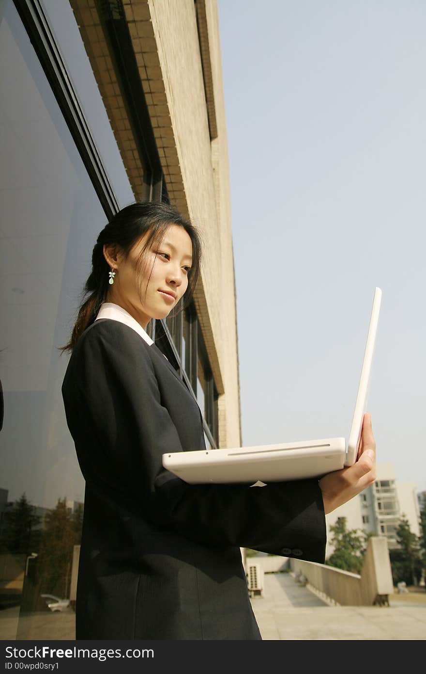 Woman studying on PC in park. Woman studying on PC in park