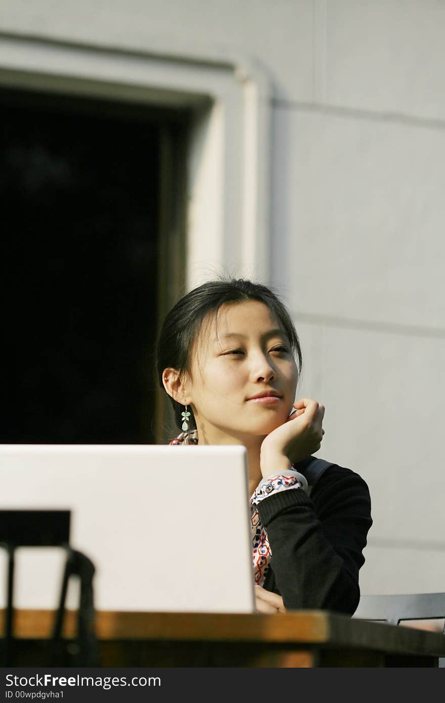 Woman studying on PC in park. Woman studying on PC in park