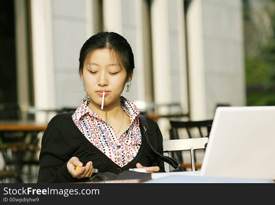 Woman studying on PC in park. Woman studying on PC in park