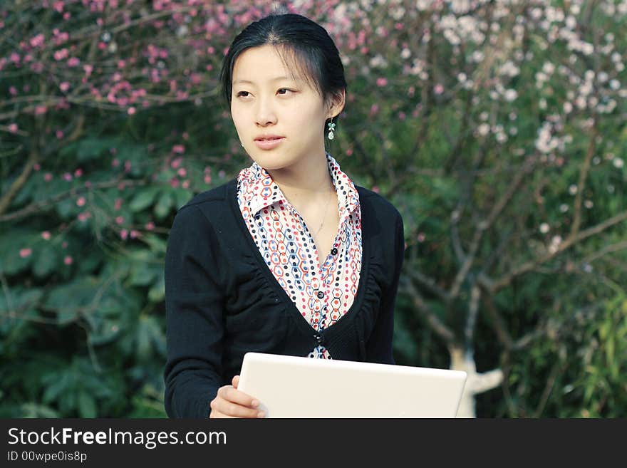 Woman studying on PC in park. Woman studying on PC in park