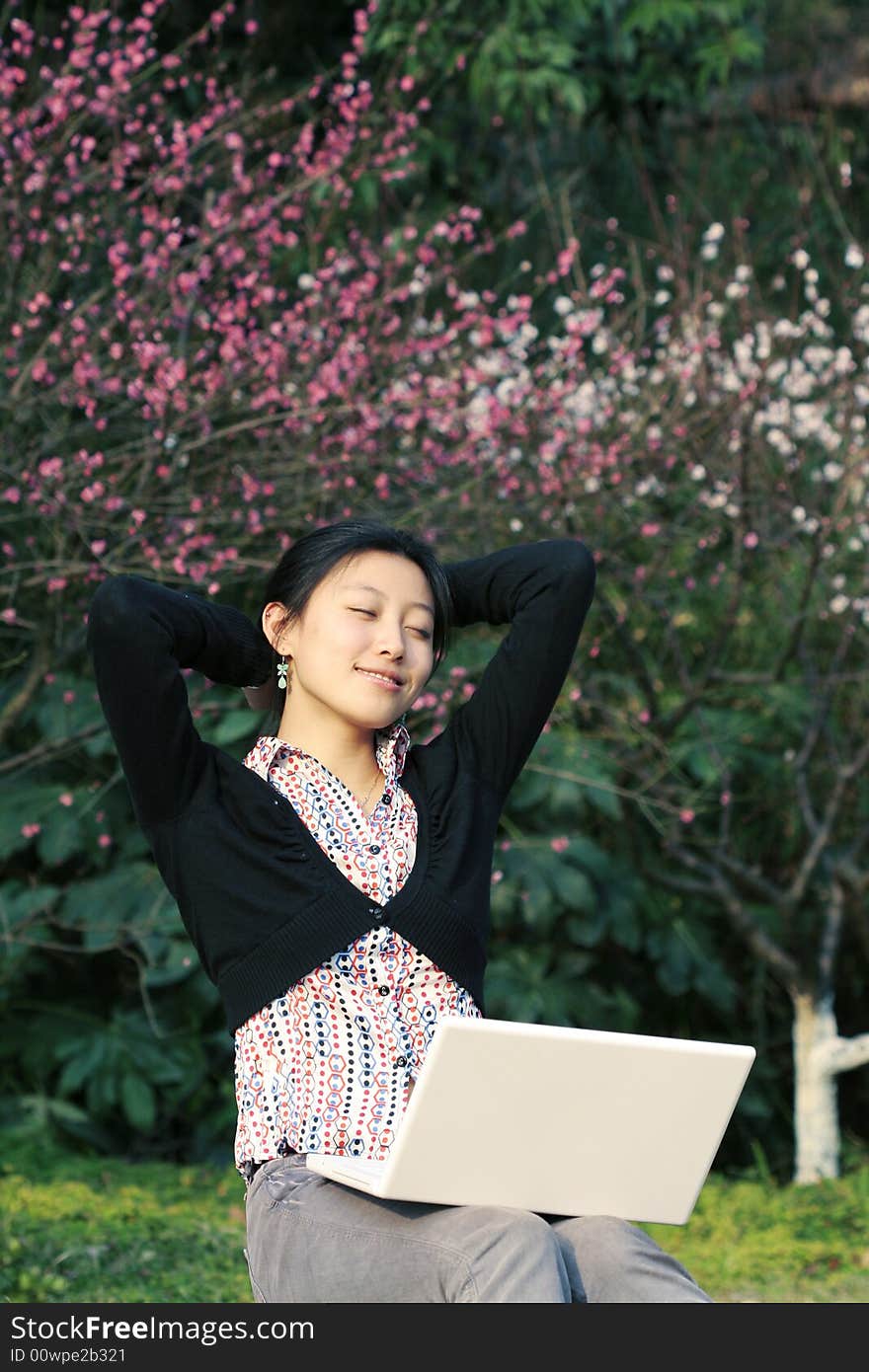 Woman studying on PC in park. Woman studying on PC in park