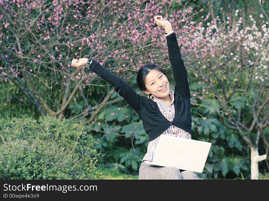 Woman studying on PC in park. Woman studying on PC in park