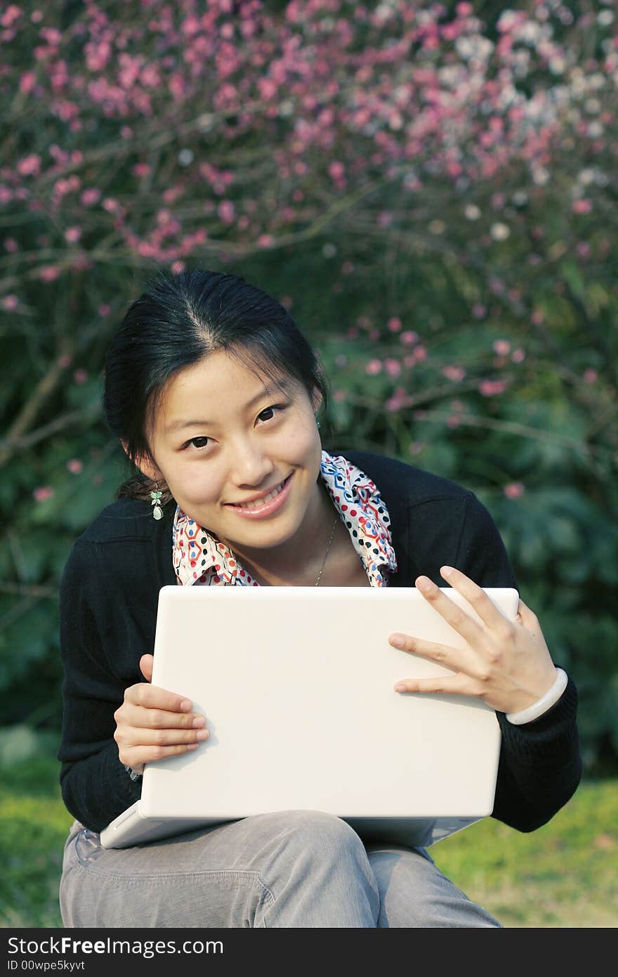 Woman studying on PC in park. Woman studying on PC in park