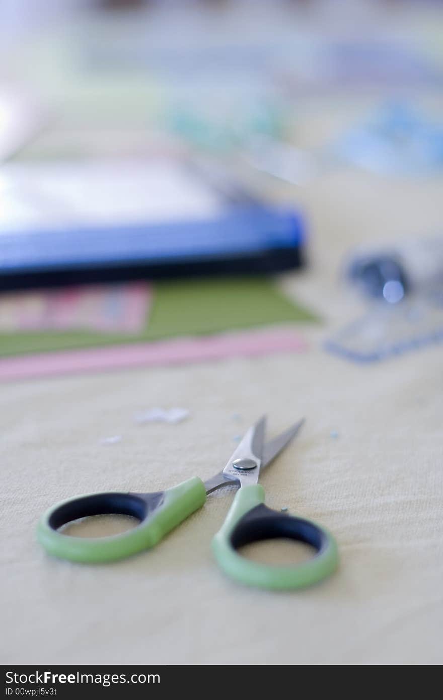 Closeup of scissors resting on a tailor's table. Closeup of scissors resting on a tailor's table.