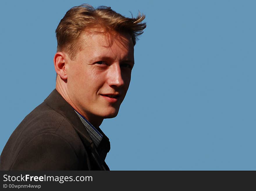 Portrait of a young man against blue background