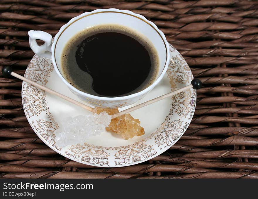 Antique cup and saucer with gold pattern. Antique cup and saucer with gold pattern