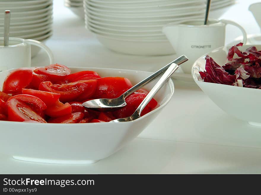 2 big bowls of salads and tomatoes. 2 big bowls of salads and tomatoes