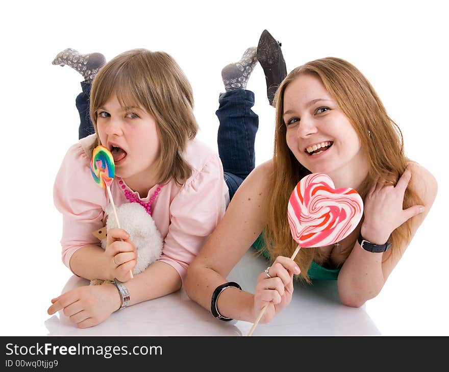 The two young attractive girls isolated on a white