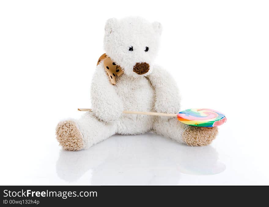 The teddy bear isolated on a white