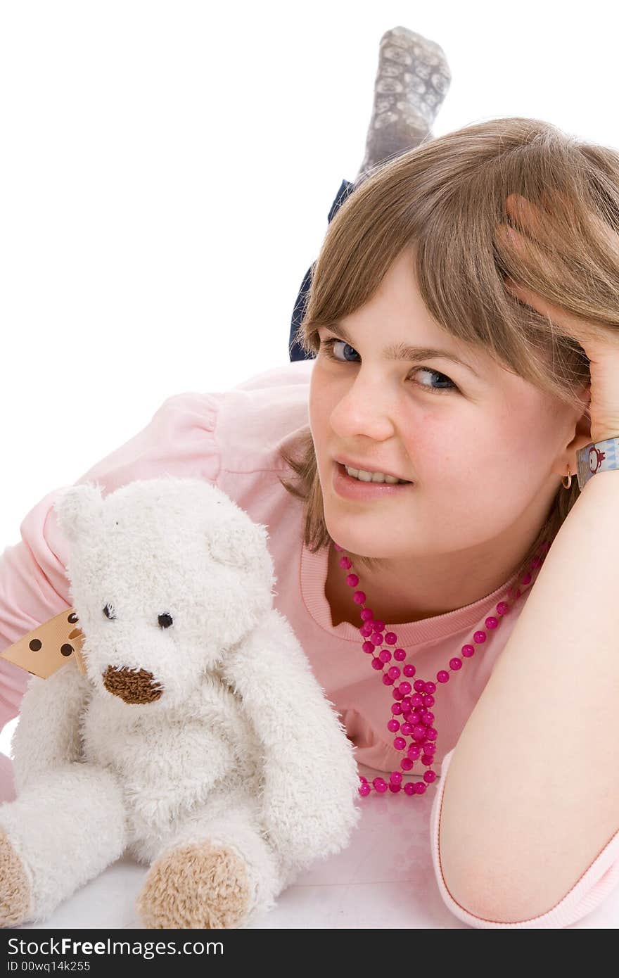 The young girl with a teddy bear isolated on a white background