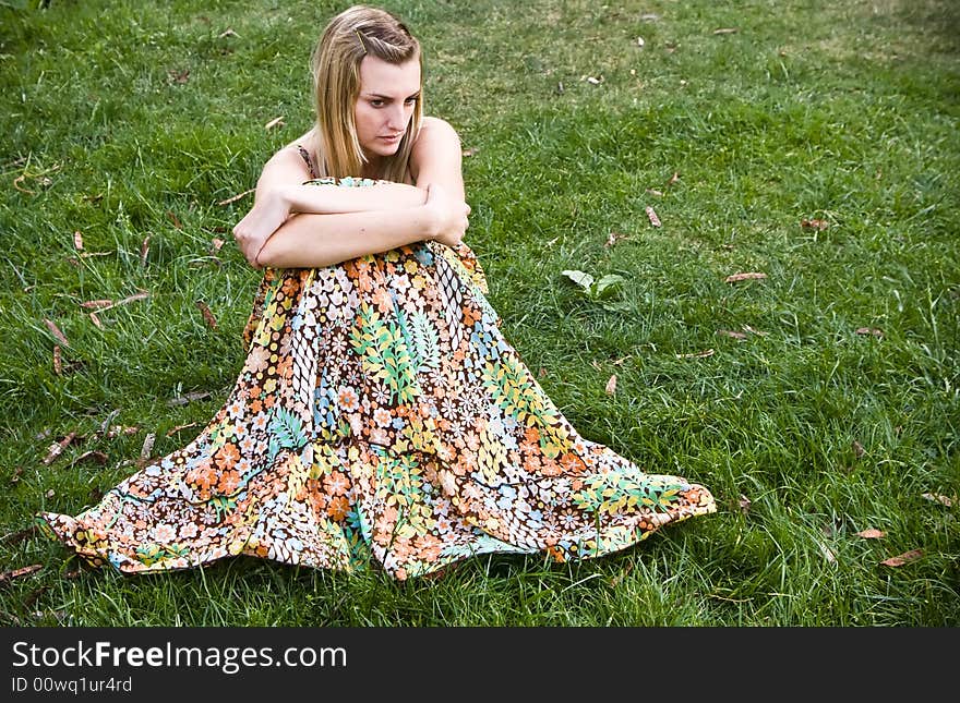 Young blond woman over the grass. Young blond woman over the grass.