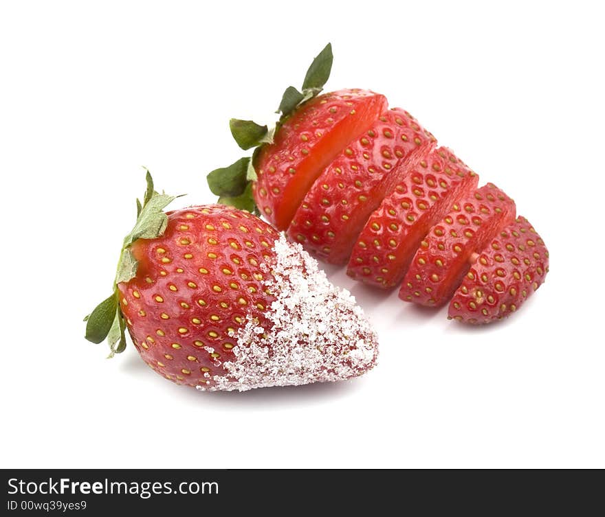 Strawberry - sliced and with sugar- on a white background