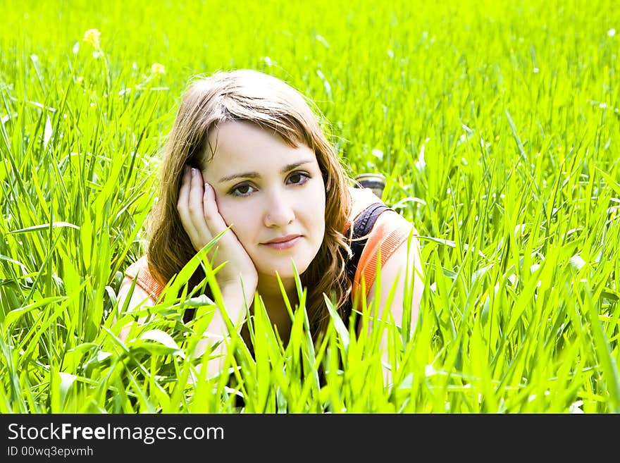 Young pensive on the grass