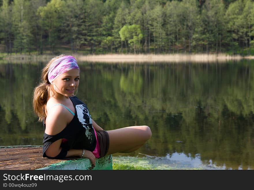 Portrait of young sexual girl on lake background